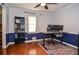 Bright office space with wood floors, blue wainscoting, and a large window for natural light at 1206 Tred Avon Sw Way, Lilburn, GA 30047