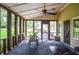 Inviting screened porch with an outdoor dining area, ideal for enjoying meals in a serene setting at 1206 Tred Avon Sw Way, Lilburn, GA 30047