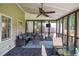 Comfortable screened porch with stylish furniture, perfect for outdoor entertaining and relaxation at 1206 Tred Avon Sw Way, Lilburn, GA 30047