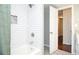 Clean, bright bathroom with modern white subway tile, chrome fixtures, and a glass-enclosed shower at 1216 Oleander Sw Dr, Lilburn, GA 30047