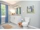 Charming bathroom with blue curtains, neutral walls, stylish decor, and a modern vanity at 1216 Oleander Sw Dr, Lilburn, GA 30047