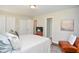 Comfortable bedroom with neutral walls, plush bedding, and a cozy accent chair at 1216 Oleander Sw Dr, Lilburn, GA 30047