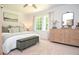 Bright bedroom with white walls, a large window, carpeted floor, and a comfortable bed with stylish pillows at 1216 Oleander Sw Dr, Lilburn, GA 30047
