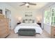 Cozy bedroom featuring carpet, white walls, a comfortable bed, and natural light from the windows at 1216 Oleander Sw Dr, Lilburn, GA 30047