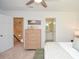 Comfortable bedroom with neutral walls and carpeted floor, leading to an open doorway at 1216 Oleander Sw Dr, Lilburn, GA 30047