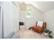 Bonus room with a comfortable chair, closet, and natural light at 1216 Oleander Sw Dr, Lilburn, GA 30047