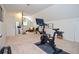 Spacious bonus room featuring fitness equipment and a comfortable seating area at 1216 Oleander Sw Dr, Lilburn, GA 30047