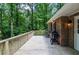 Wooden deck with a grill and outdoor dining table for entertaining at 1216 Oleander Sw Dr, Lilburn, GA 30047