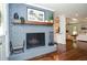 Elegant dining area with hardwood floors, a fireplace, and an open floor plan at 1216 Oleander Sw Dr, Lilburn, GA 30047