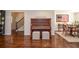 Elegant entryway featuring a piano, hardwood floors, and views of the dining room and staircase at 1216 Oleander Sw Dr, Lilburn, GA 30047