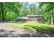 Charming two-story home with lush landscaping and a spacious front yard offering curb appeal and outdoor enjoyment at 1216 Oleander Sw Dr, Lilburn, GA 30047