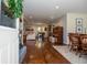 Inviting foyer with hardwood floors leading into a dining and living area with a fireplace at 1216 Oleander Sw Dr, Lilburn, GA 30047