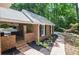 Charming brick home with a brick walkway and professional landscaping at 1216 Oleander Sw Dr, Lilburn, GA 30047