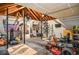 Image of home gym in garage featuring weight training equipment and lawnmower at 1216 Oleander Sw Dr, Lilburn, GA 30047