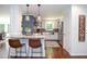 Stylish kitchen with stainless steel appliances, white cabinetry, and a breakfast bar for casual dining at 1216 Oleander Sw Dr, Lilburn, GA 30047