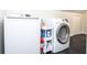 Laundry room equipped with a washer and dryer and black flooring at 1216 Oleander Sw Dr, Lilburn, GA 30047