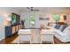 Cozy living room featuring hardwood floors, comfortable seating, and stylish decor at 1216 Oleander Sw Dr, Lilburn, GA 30047