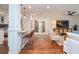 Bright living room featuring hardwood floors, stylish furniture, and a view into the backyard at 1216 Oleander Sw Dr, Lilburn, GA 30047