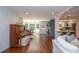 Open-concept living space with a piano, dining area, kitchen, and comfortable seating at 1216 Oleander Sw Dr, Lilburn, GA 30047