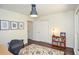 Bright home office featuring hardwood floors, a closet, and a stylish rug at 1216 Oleander Sw Dr, Lilburn, GA 30047