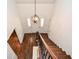 Bright foyer with a staircase and an overhead view to the front door featuring a modern light fixture at 1216 Oleander Sw Dr, Lilburn, GA 30047