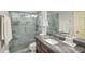 Modern bathroom featuring a glass shower, marble countertops, and sleek fixtures at 132 East Ne Dr, Atlanta, GA 30305