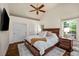 Inviting bedroom features a ceiling fan, natural light, and hardwood flooring at 132 East Ne Dr, Atlanta, GA 30305