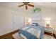 Comfortable bedroom with vaulted ceilings, a wooden ceiling fan, and a cozy queen-sized bed at 132 East Ne Dr, Atlanta, GA 30305