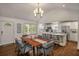 Bright dining area features a wooden table next to white kitchen with stainless steel appliances at 132 East Ne Dr, Atlanta, GA 30305