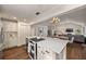 Open kitchen featuring an island with seating and access to the living and dining areas at 132 East Ne Dr, Atlanta, GA 30305