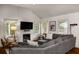 Inviting living room with fireplace, modern furnishings, and ample natural light from surrounding windows at 132 East Ne Dr, Atlanta, GA 30305