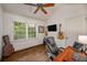 Home office featuring natural light, hardwood floors, and a ceiling fan at 132 East Ne Dr, Atlanta, GA 30305