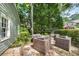 Outdoor patio area with stone pavers, seating, and mature trees at 132 East Ne Dr, Atlanta, GA 30305