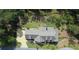 Aerial view of manicured lawn and home set on wooded lot at 23 Sunset Se Rdg, Cartersville, GA 30121