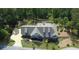 Aerial view of home and backyard playhouse set on wooded lot at 23 Sunset Se Rdg, Cartersville, GA 30121