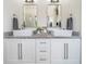 Bathroom featuring dual sinks, granite countertops, white cabinets, and chrome fixtures at 23 Sunset Se Rdg, Cartersville, GA 30121