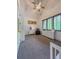 Bedroom features white dressers, a blue chair and multiple windows at 23 Sunset Se Rdg, Cartersville, GA 30121