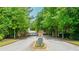 Gated entrance to a private community with a beautifully landscaped entrance at 23 Sunset Se Rdg, Cartersville, GA 30121