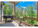 Covered deck featuring stainless grill and green, scenic backyard views at 23 Sunset Se Rdg, Cartersville, GA 30121