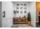 Welcoming entryway with wood-look flooring, a rustic console table, decorative baskets, and framed artwork for a cozy atmosphere at 23 Sunset Se Rdg, Cartersville, GA 30121