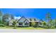 Inviting two-story home featuring a manicured lawn and a charming covered porch, perfect for enjoying the outdoors at 23 Sunset Se Rdg, Cartersville, GA 30121