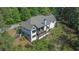View of the side and rear exterior elevation of the home with tiered porches at 23 Sunset Se Rdg, Cartersville, GA 30121
