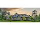 Stunning single-story home with beautiful architecture and mature landscaping under a picturesque sky at 23 Sunset Se Rdg, Cartersville, GA 30121