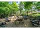 Attractive firepit area with Adirondack chairs, landscaped surroundings and a tranquil outdoor setting at 23 Sunset Se Rdg, Cartersville, GA 30121