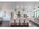 The open-concept kitchen includes a large center island with seating, stainless steel appliances, and sleek white cabinets at 23 Sunset Se Rdg, Cartersville, GA 30121