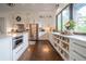 A bright and modern kitchen with seating and stainless steel appliances at 23 Sunset Se Rdg, Cartersville, GA 30121