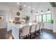 Bright open kitchen boasts an island with seating, stainless steel appliances, and lots of natural light at 23 Sunset Se Rdg, Cartersville, GA 30121