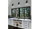Natural light and modern fixtures give this kitchen character. Note all the storage! at 23 Sunset Se Rdg, Cartersville, GA 30121