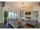Inviting living room with stone fireplace, large windows, and comfortable seating with access to an outdoor space at 23 Sunset Se Rdg, Cartersville, GA 30121
