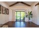 Spacious, naturally lit room with hardwood floors, large glass doors, and elegant curtains at 23 Sunset Se Rdg, Cartersville, GA 30121